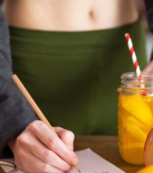 close-up-hand-writing-notebook 2