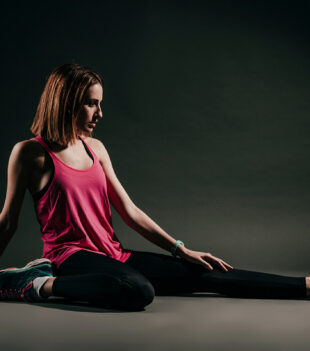 serious-woman-flexing-studio 1