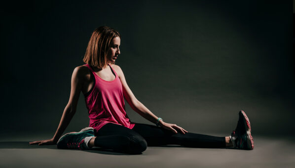 serious-woman-flexing-studio 1